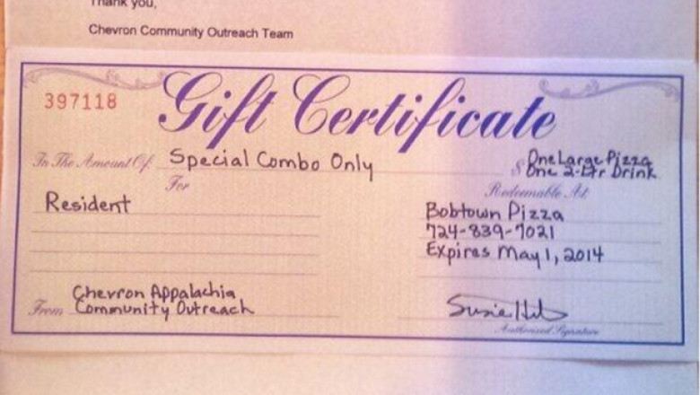 Chevron a oferit cupoane de pizza si suc unor persoane afectate de scurgeri de gaze Imagine