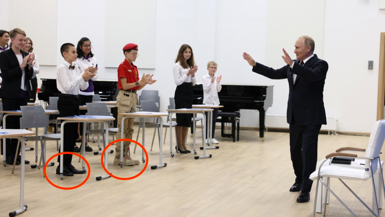 Copii imbracati in uniforma si bocanci cu cateva numere mai mari, adusi la „lectia de istorie” a lui Putin Imagine