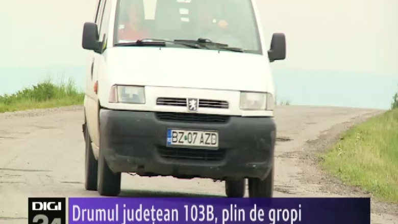 Drumul judetean 103B, plin de gropi  Imagine