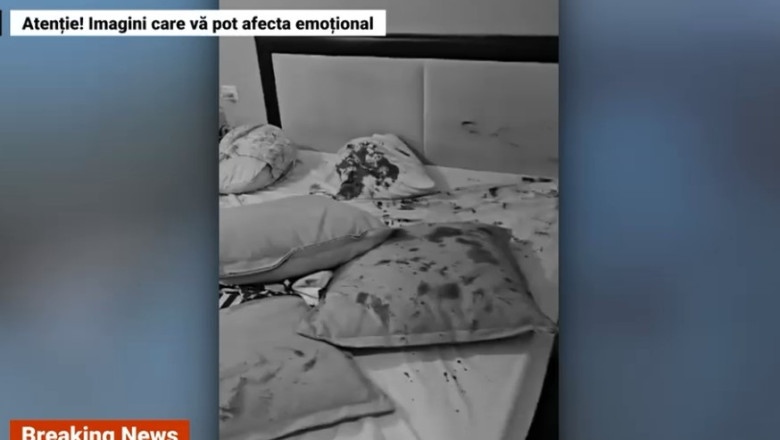 Imagini din casa unei familii executate de Hamas. Doar cainele a fost lasat in viata si refuza sa plece din patul copiilor Imagine