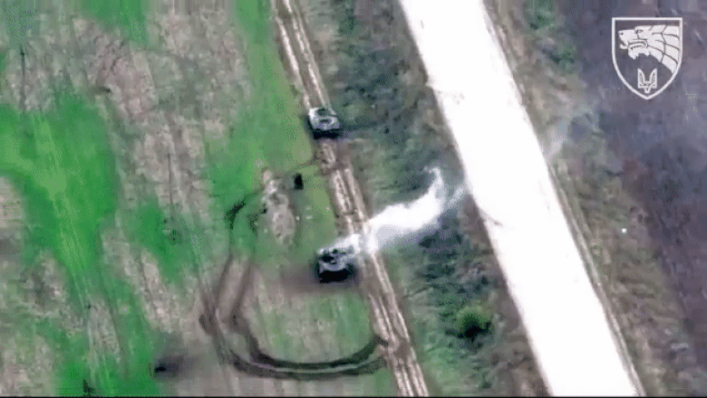 Imagini dramatice: un militar rus coboara din blindat pentru a-si ajuta un camarad ranit. Peste cateva secunde, masina sare in aer Imagine