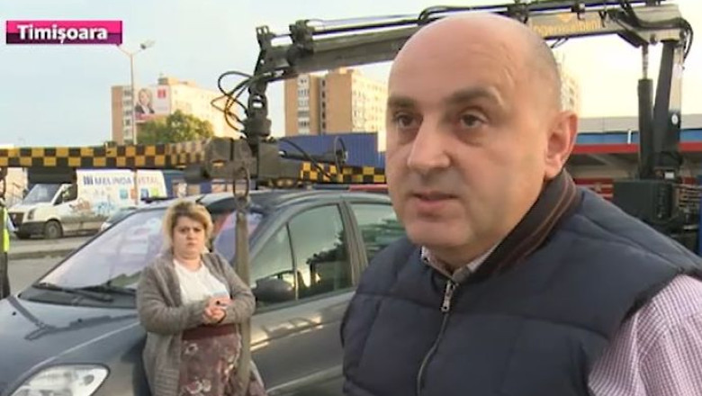Masina ridicata, cu discutii aprinse, in parcarea unui magazin din Timisoara  Imagine