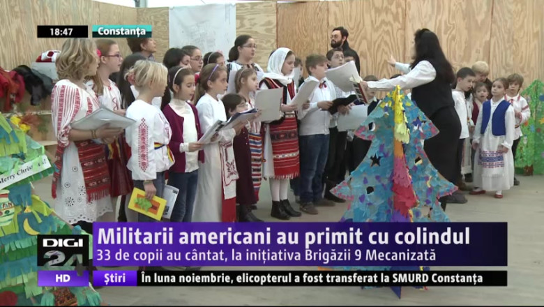 Militarii americani au primit cu colindul. 33 de copii au cantat, la initiativa Brigazii 9 Mecanizata Imagine
