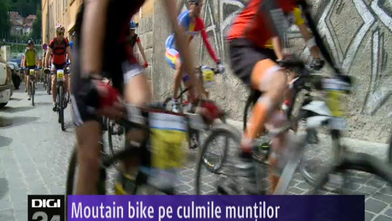 Moutain bike pe culmile muntilor Imagine