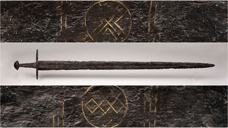 O sabie veche de 1.000 de ani, decorata cu simboluri spirituale, a fost descoperita intr-un rau din Olanda Imagine