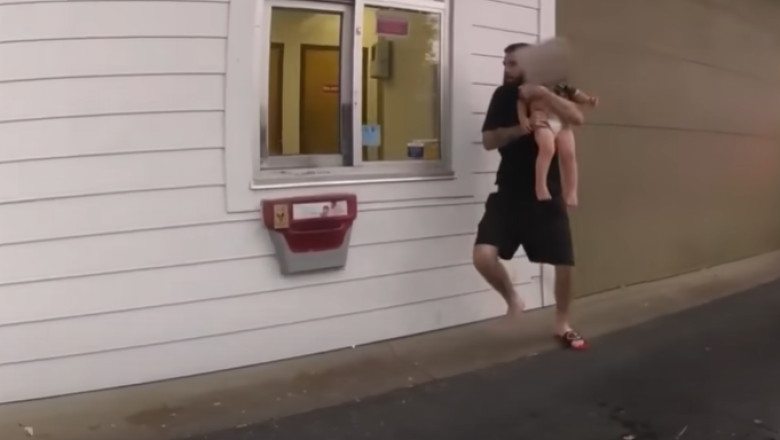 Un barbat care si-a rapit copilul de un an l-a folosit apoi ca scut uman, cand a fost prins de politie Imagine