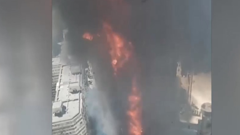 Un zgarie-nori din China a ars ca o torta. Martorii din cladirea de vizavi au stat la geam si au filmat incendiul Imagine