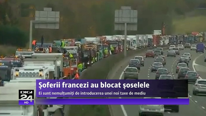 VIDEO Indignati de introducerea unei noi taxe de mediu, soferii de TIR din Franta scot 4500 de camioane pe sosele Imagine