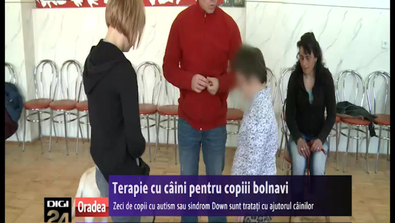 Zeci de copii cu autism sau sindrom Down sunt tratati cu ajutorul cainilor special dresati Imagine